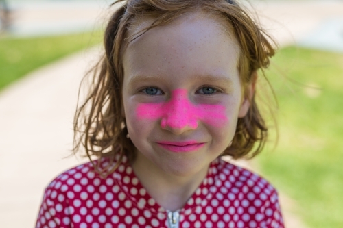 girl wearing pink zink sun protection and a rashie - Australian Stock Image