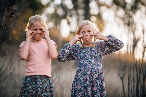 Girls making silly faces in bushland - Australian Stock Image