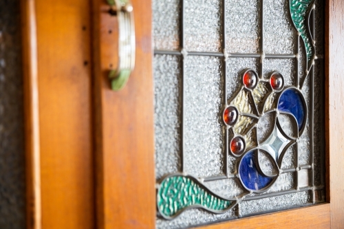 Glass leadlight in cupboard door - Australian Stock Image