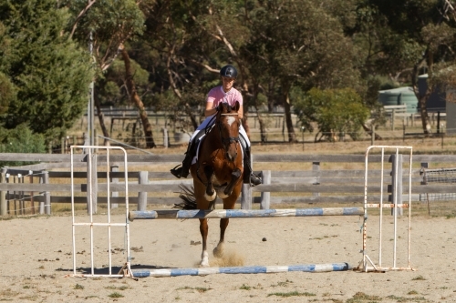 Going Over the Jump - Australian Stock Image