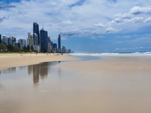 Gold Coast beach with city skyline in the background - Australian Stock Image