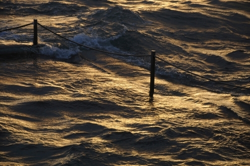 Golden light over ocean - Australian Stock Image