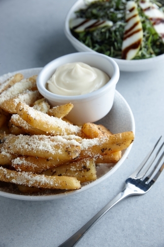 Gourmet hot chips with mayonnaise dip - Australian Stock Image