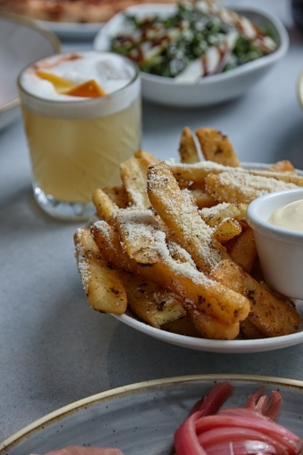 Gourmet hot chips with mayonnaise dip - Australian Stock Image