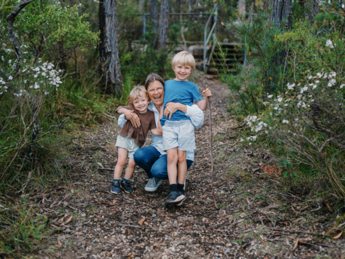 Grandmother enjoying Australian Bushland with her Grandchildren - Australian Stock Image