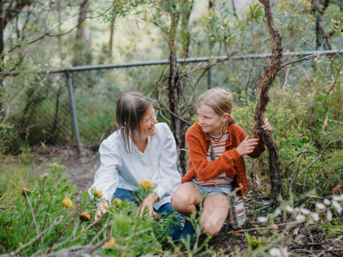 Grandmother showing young granddaughter Australian Natives - Australian Stock Image