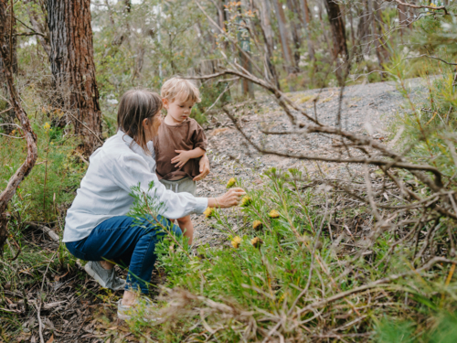 Grandmother spending time with grandson in nature - Australian Stock Image