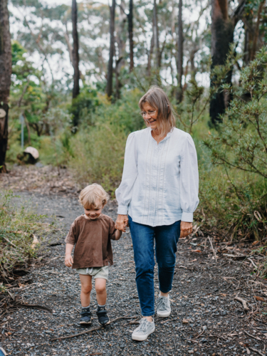 Grandmother spending time with grandson in nature - Australian Stock Image