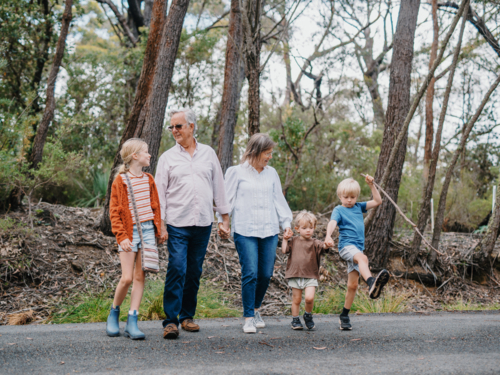 Grandparents enjoying Australian Bushland with their young Grandchildren - Australian Stock Image