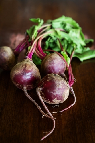 Group of whole beetroot vegetable on a wooden table