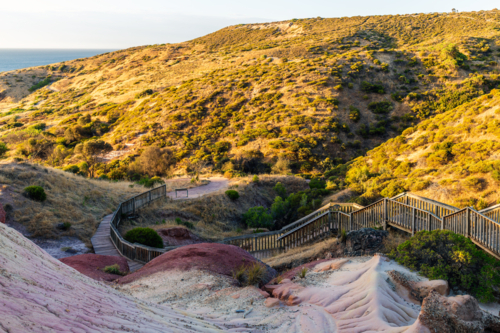 Hallett Cove boardwalk around the iconic Sugarloaf mountain at sunset, South Australia - Australian Stock Image