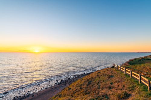 Hallett Cove Conservation Park Coastal Walkway along the coast with sea views at sunset - Australian Stock Image