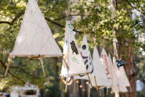 Hand painted tent lanterns hanging on a line. - Australian Stock Image