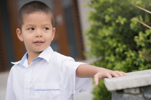 Handsome boys in school uniform leave home for their first day of school - Australian Stock Image