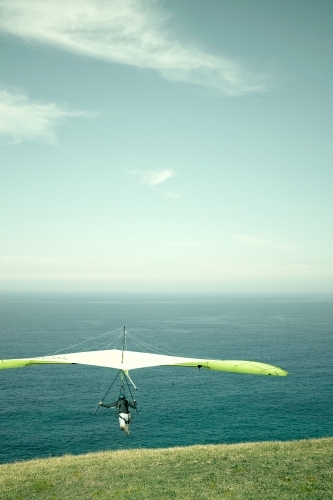 Hang glider taking off to the horizon on a beautiful day - Australian Stock Image