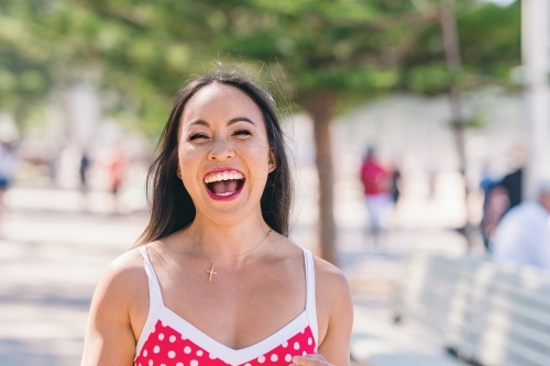 happy asian woman in bikini - Australian Stock Image