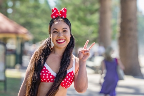 happy Asian woman in bikini - Australian Stock Image