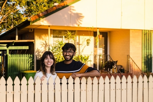 happy couple in front of their home - Australian Stock Image