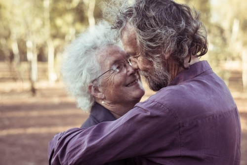 Happy elderly couple kiss in the Northern Territory