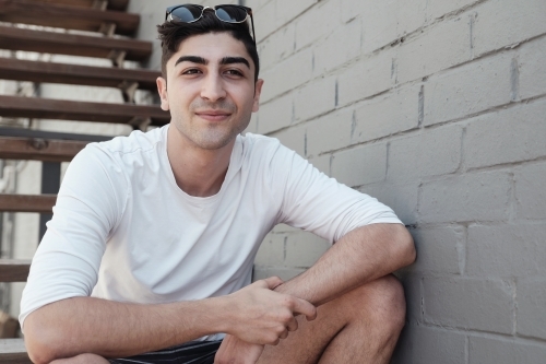 Happy multicultural young adult man, university student - Australian Stock Image