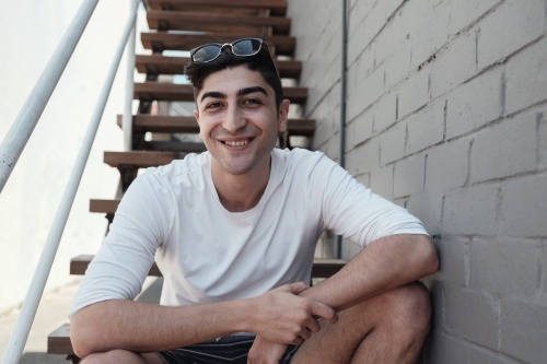 Happy multicultural young adult man, university student - Australian Stock Image