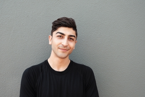 Happy multicultural young adult man, university student - Australian Stock Image