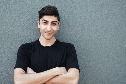 Happy multicultural young adult man, university student - Australian Stock Image