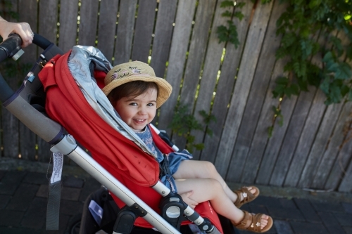 Happy toddler in pram - Australian Stock Image