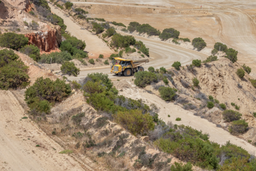 Haul truck driving out of open cut mine with a full load - Australian Stock Image