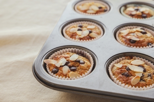 Healthy oatmeal cupcake in baking tray - Australian Stock Image