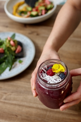 Healthy organic purple berry smoothie drink - Australian Stock Image