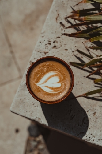 Heart latte coffee art in ceramic cup on a marble tile. - Australian Stock Image