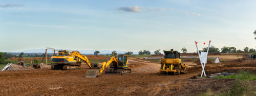 heavy earthmoving machinery on earthworks construction site for Singleton Bypass - Australian Stock Image