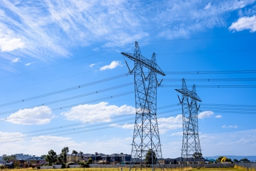 High voltage power transmission tower on blue sky background,  electricity distribution. - Australian Stock Image