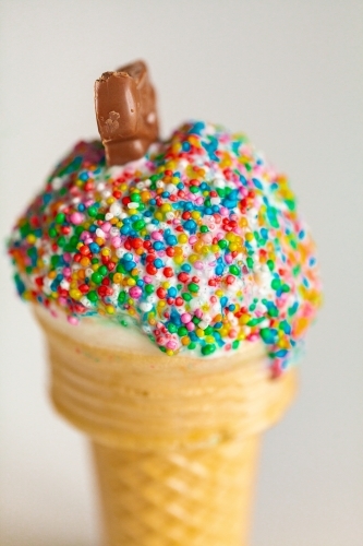 home made ice cream with chocolate and hundreds and thousands of colourful sprinkles - Australian Stock Image