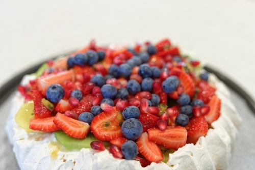 Home made traditional Australian Pavlova with fruit topping - Australian Stock Image
