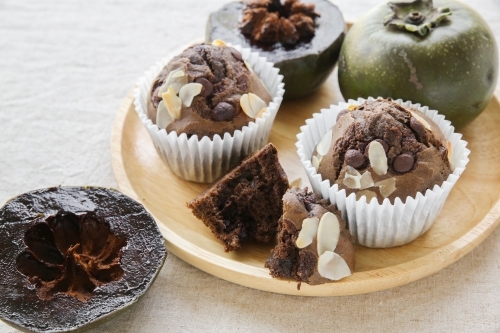 Homemade cupcakes made from Black sapote chocolate pudding fruit - Australian Stock Image