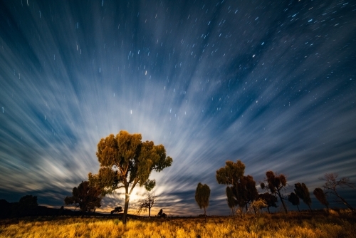 Horizontal shot of a night time lapse on the starry sky and clouds - Australian Stock Image