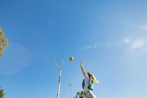 horizontal shot of a young woman celebrating after scoring in a net ball game - Australian Stock Image