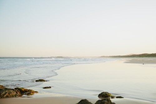 Horizontal shot of beach at sunset - Australian Stock Image