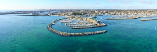 Panoramic shot of Fremantle's Challenger Harbour on a sunny day with boats, yachts. trees and groyne - Australian Stock Image