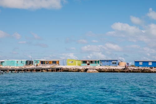 Horizontal shot of colorful fishing shacks - Australian Stock Image