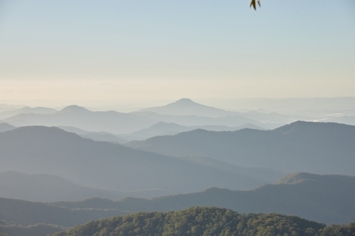 Horizontal shot of mountains on a misty day - Australian Stock Image