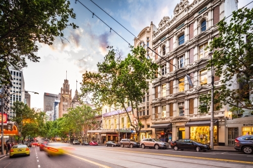 Horizontal shot of parked cars along the road in the city on a sunny day - Australian Stock Image