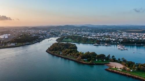 Horizontal shot of Spinnaker Park and Auckland Creek with Gladstone in the background - Australian Stock Image