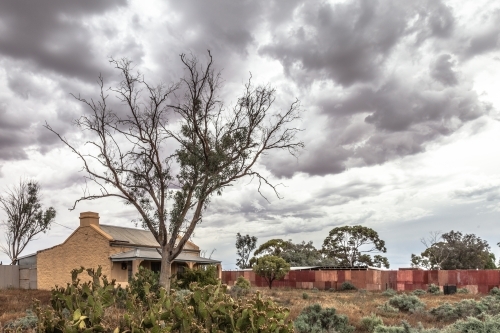 House under a grey sky - Australian Stock Image