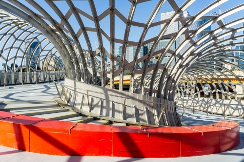 Inside view of 180 degree curve in an enclosed webbed steel pedestrian bride - Australian Stock Image