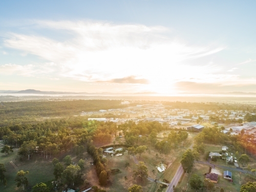 Intersection of bush and built environment, rural edge of town industrial area - Australian Stock Image