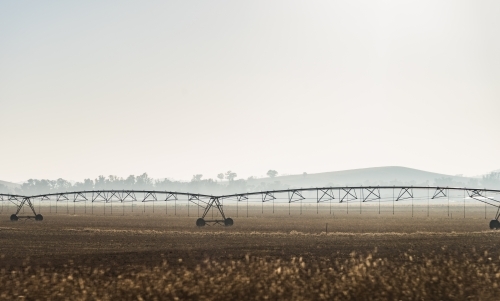 irrigation equipment on the land early morning - Australian Stock Image