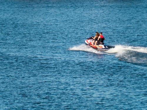 Jet ski speeding across water